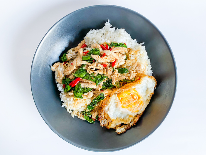 Rice topped with chicken with Thai basil and fried egg