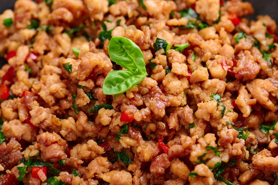 Pad Krapow Gai - Thai Basil Chicken close up. Pad Krapow is Thai cuisine dish with minced chicken or pork meat, basil, soy and oyster sauces. Thai Food